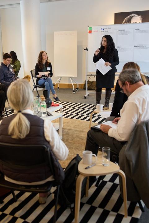 Attendees break up into group discussions at Ikea One Home One Planet event