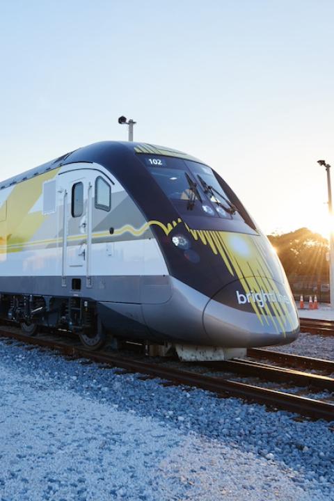 A Brightline train on the tracks. 