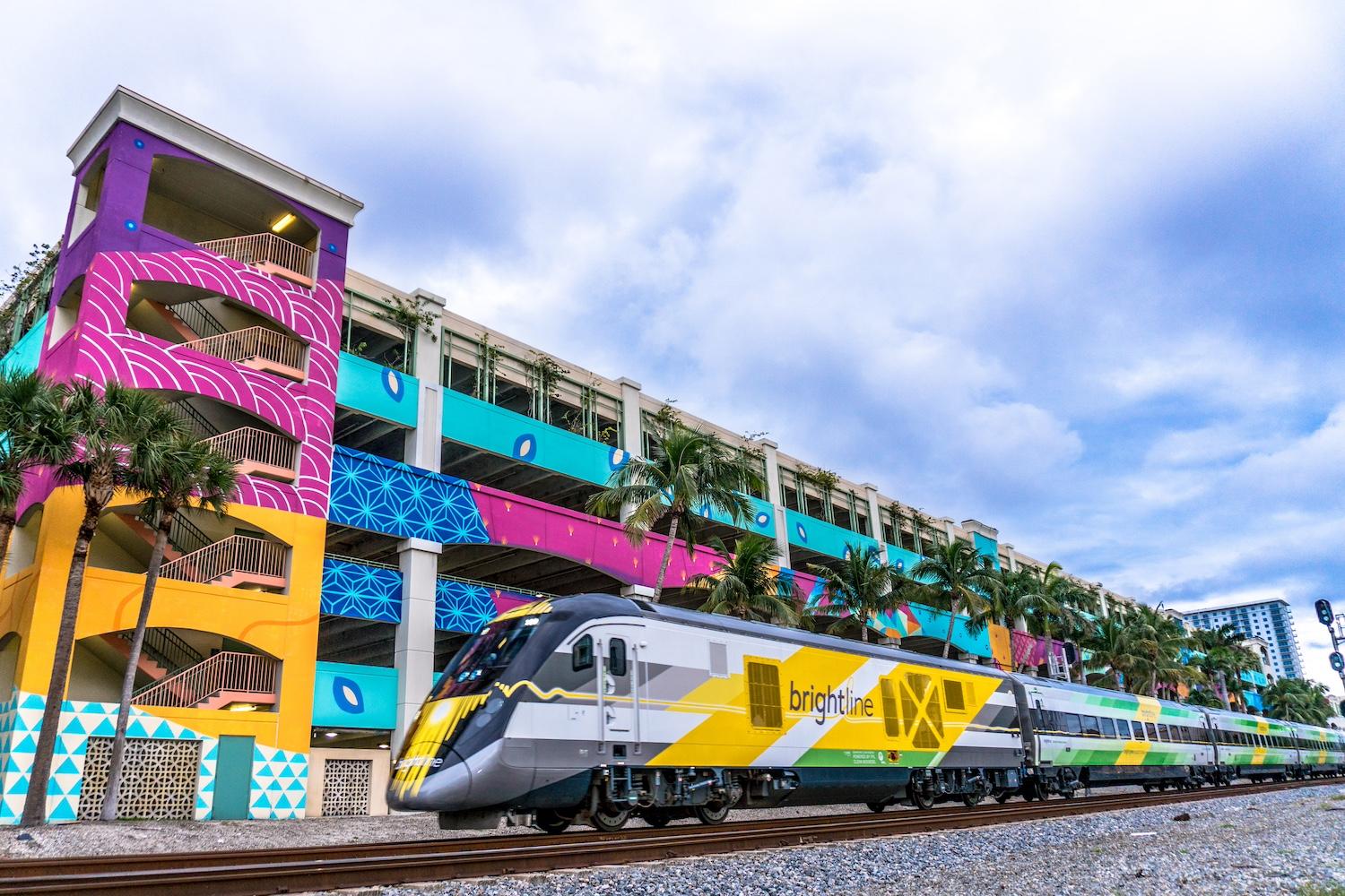 A Brightline train on the tracks.