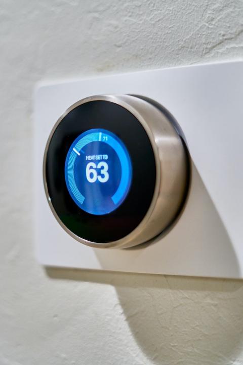 A thermostat on a wall. 