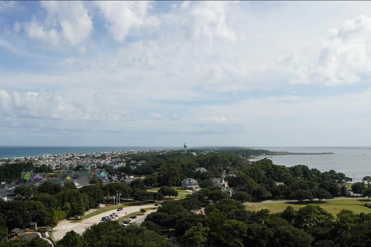 A wide view of Corolla, a community in the Northern Outer Banks, with the Currituck Sound on one side and the Atlantic Ocean on the other.