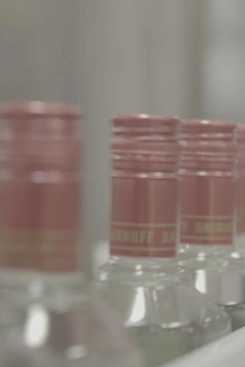 Glass bottles on a production line.