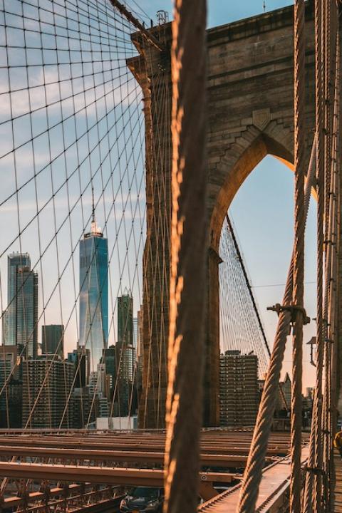 The Brooklyn Bridge during golden hour with the New York City skyline behind it — embodied carbon