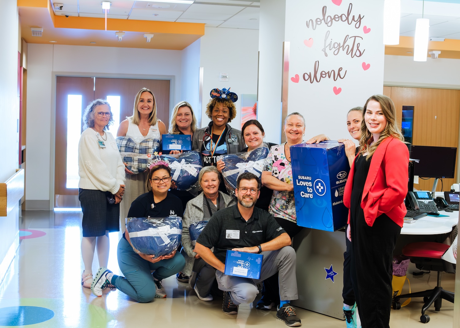 employees deliever care packages from sport subaru