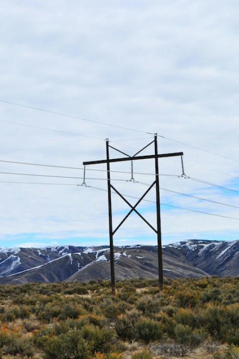 Power lines in front of mountains — electricity demand