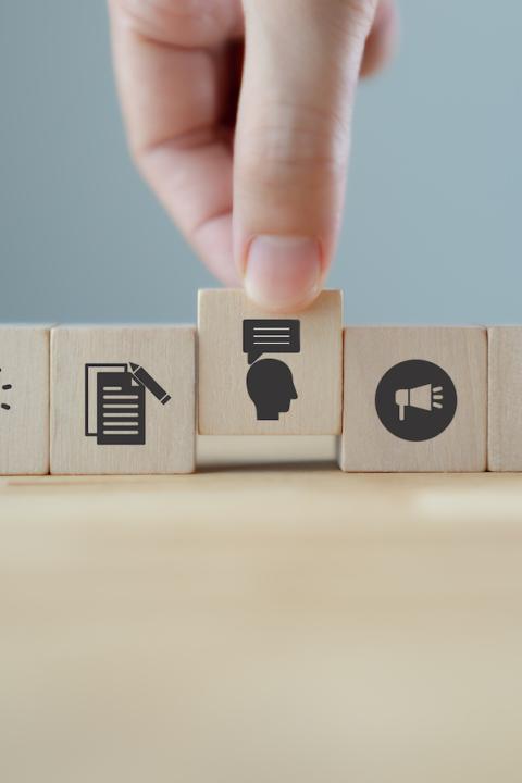 ESG communications - wooden tiles representing ideas