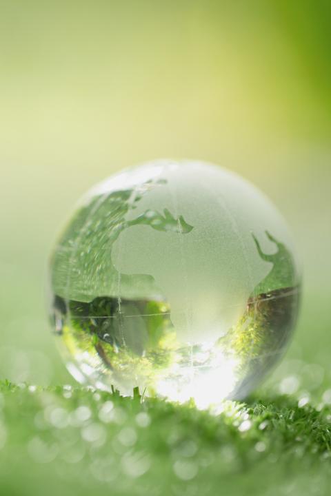Glass Globe on Leaf - representing sustainability and the circular economy.