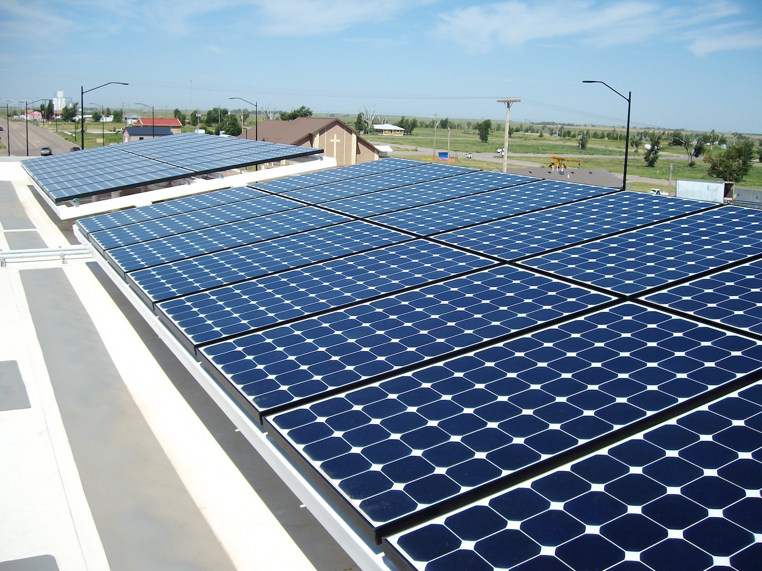 An array of solar panels on top of the Greensburg Business Incubator building.