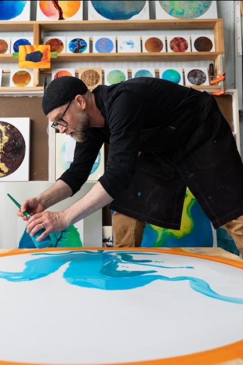 John Sabraw of Ohio University paints with pigment made from pollution in Sunday Creek