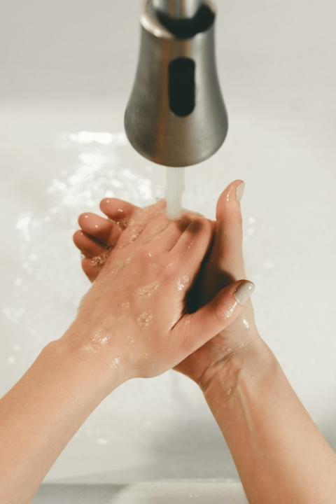 A person washing their hands — Female Founders