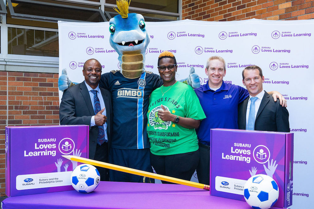 leadership from subaru and the philadelphia union and philadelphia union mascot celebrate the adoption of stetser elementary in philadelphia