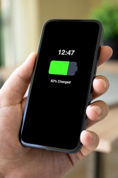 A smart phone screen displays an "82 percent charged" message — Liion Power