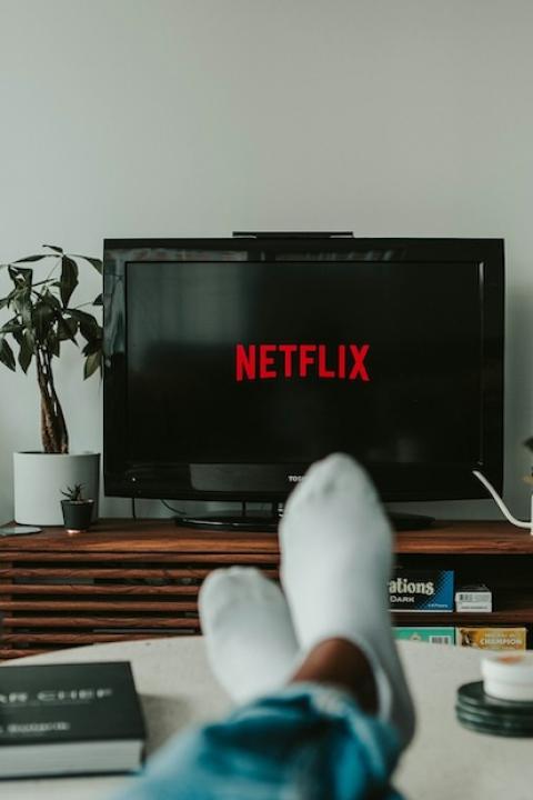 Man watching Netflix on television