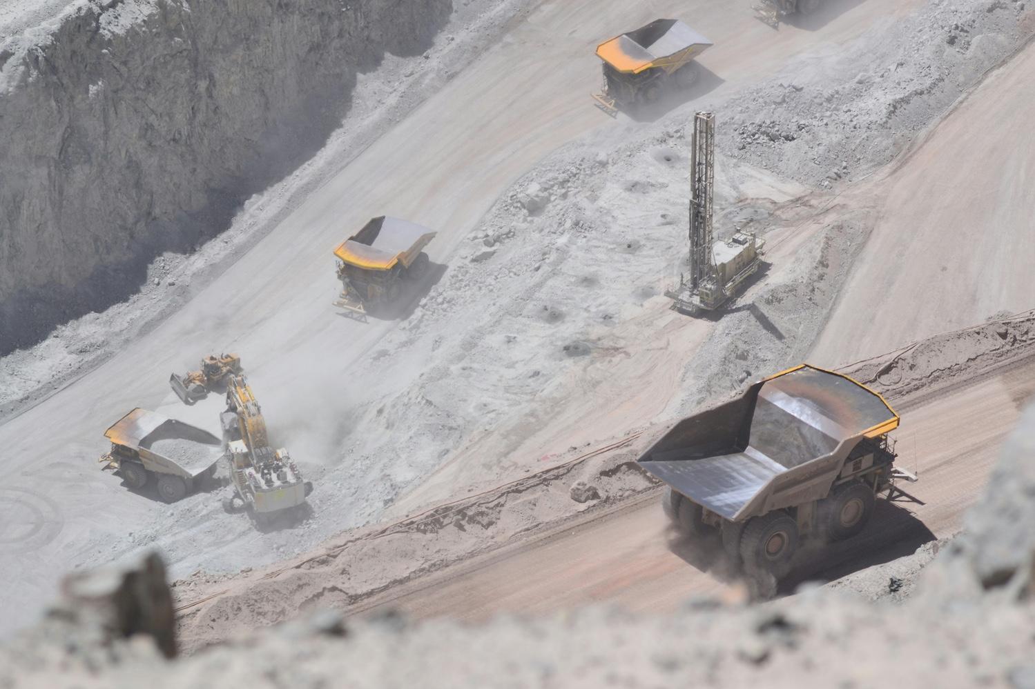 Dump trucks at the Chuquicamata mine in Chile — mining taxes