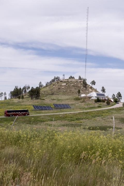 A solar array on a hill on the Pine Ridge Reservation in present-day South Dakota — Red Cloud Renewable