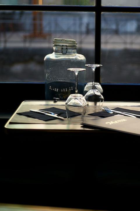 A menu on a table at a restaurant — restaurant sustainability 