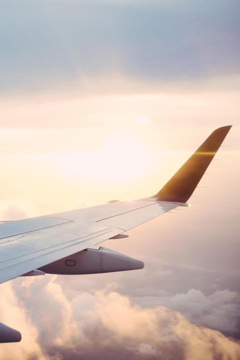 Airplane wing in the clouds