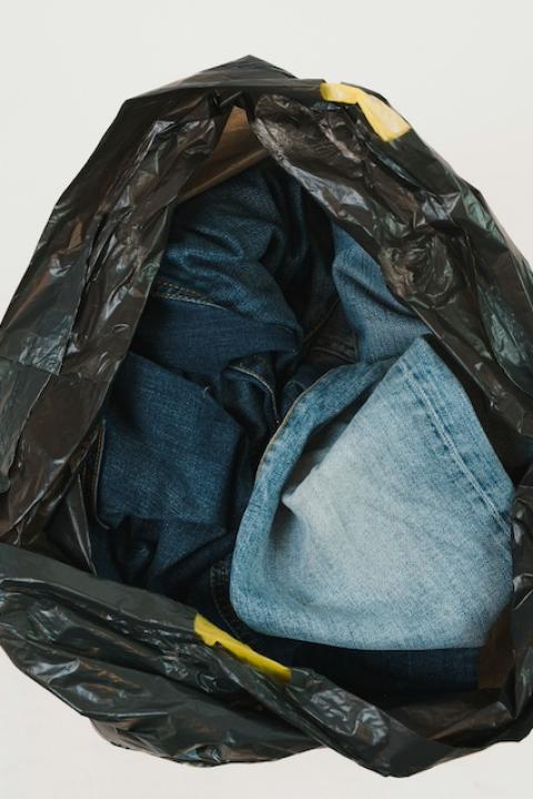 Jeans in a trash bag — repurposed denim 