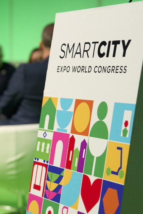 A "Smart City Expo World Congress" sign on stage at one of the event sessions.