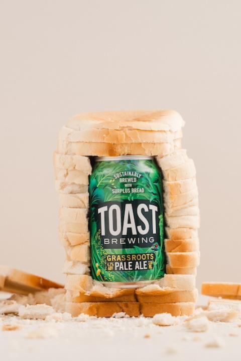 A can of Toast Brewing's beer in a loaf of bread — sustainable spirits.