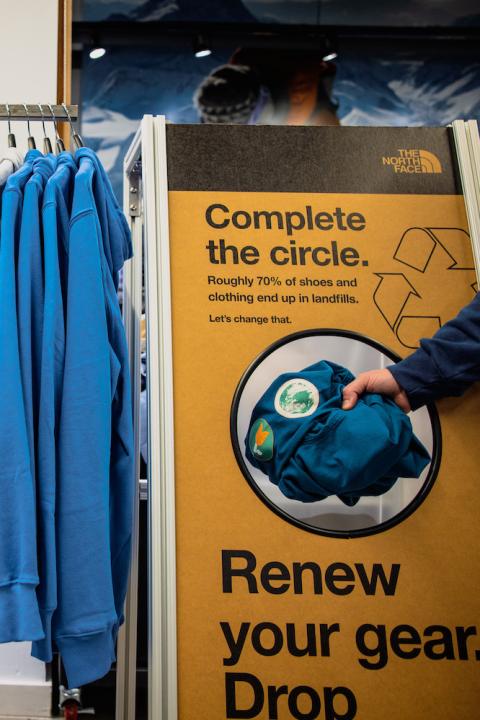 A bin at a retail location where The North Face customers can return their used gear to be refurbished or recycled - circular design and reuse in apparel