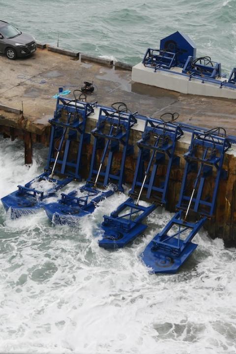 Eco Wave Power's wave energy devices attached to existing shoreline infrastructure.