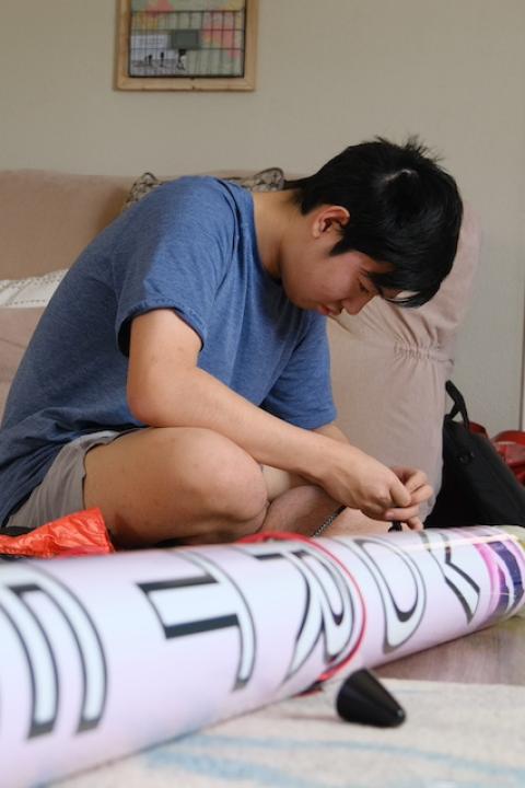 Jason Zhao working on the rocket he designed to detect and monitor a wildfire. 