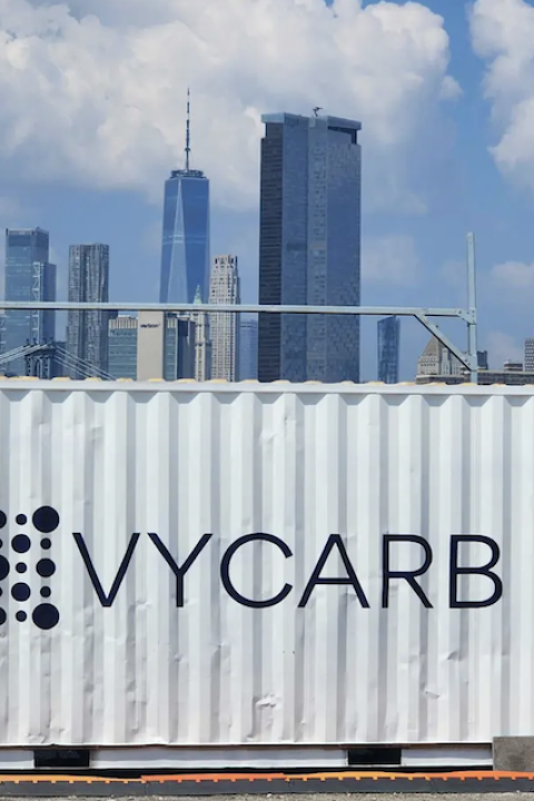 A Vycarb trailer in front of the New York City skyline along the East River — carbon dioxide removal